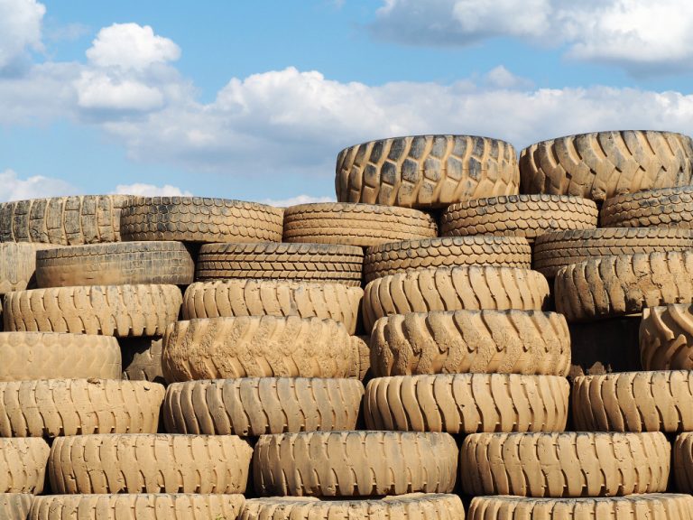 A stack of old tires in an open area