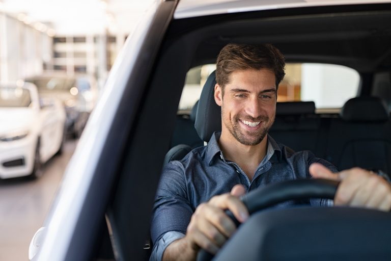 guy feeling comfortable sitting on driver seat